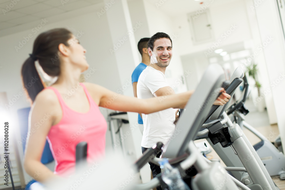 Young people training in the gym Young people training in the gym