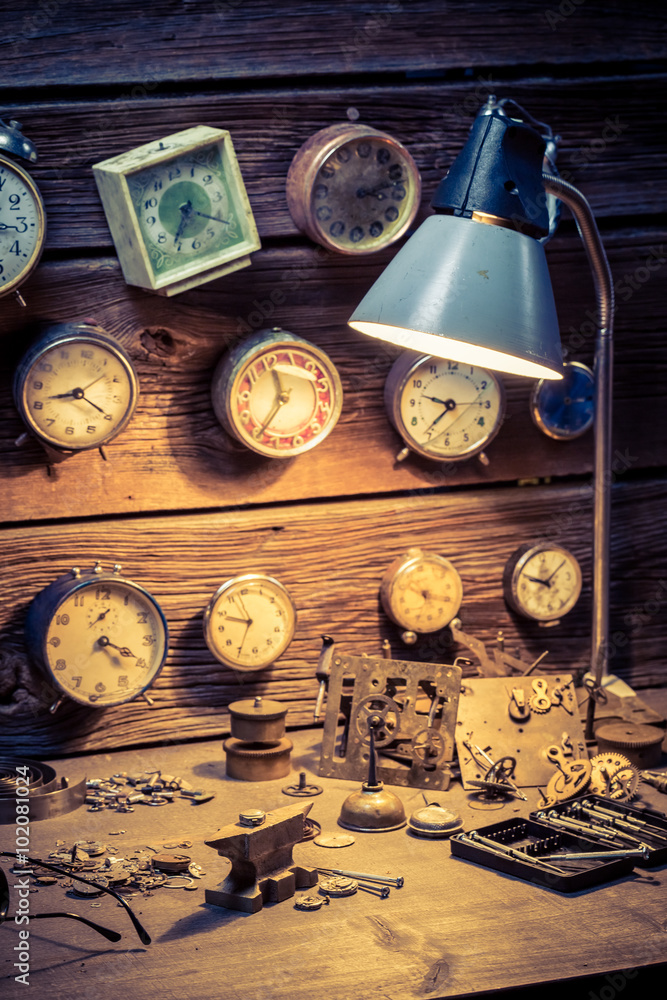 Watchmaker's workshop with many clocks Watchmaker's workshop with many clocks