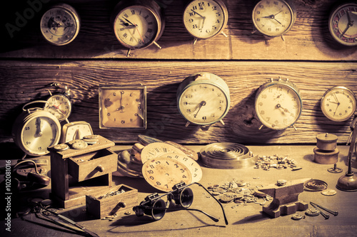 Watchmaker's workshop full of clocks