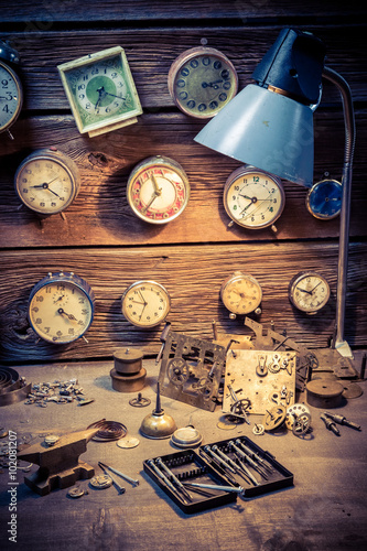 Old watchmaker's room with damaged clocks