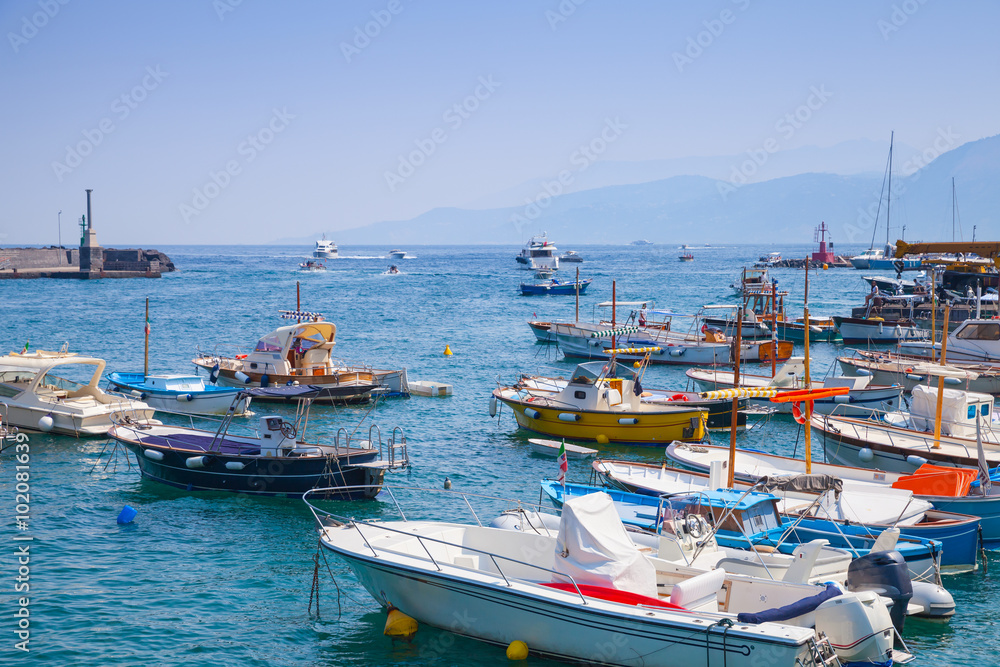 Moored pleasure motorboats in port of Capri island Moored pleasure motorboats in port of Capri island