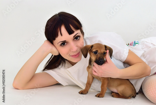 The girl with a dog in an embrace