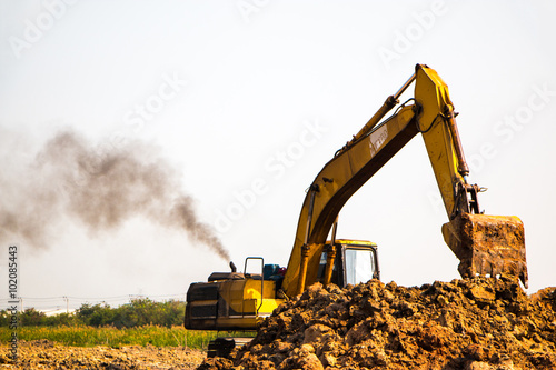 An unidentified loader backhoe is working