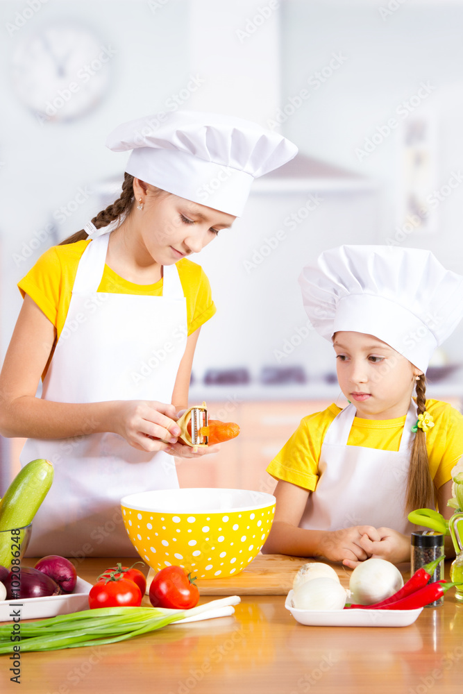 twin girl chef cut vegetables twin girl chef cut vegetables
