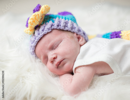 Baby with hat on fur