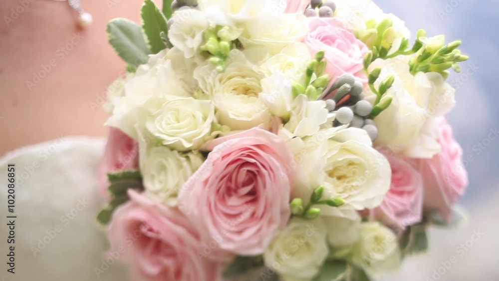 bride presses her wedding bouquet bride presses her wedding bouquet