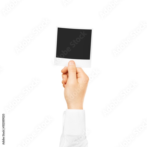 Hand holding blank photo frame mockup. Empty old photography template.