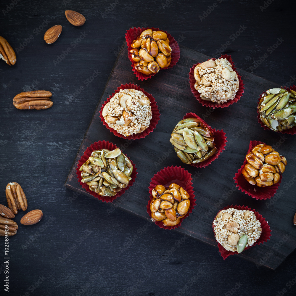 Fototapeta premium Candied nuts on cutting board