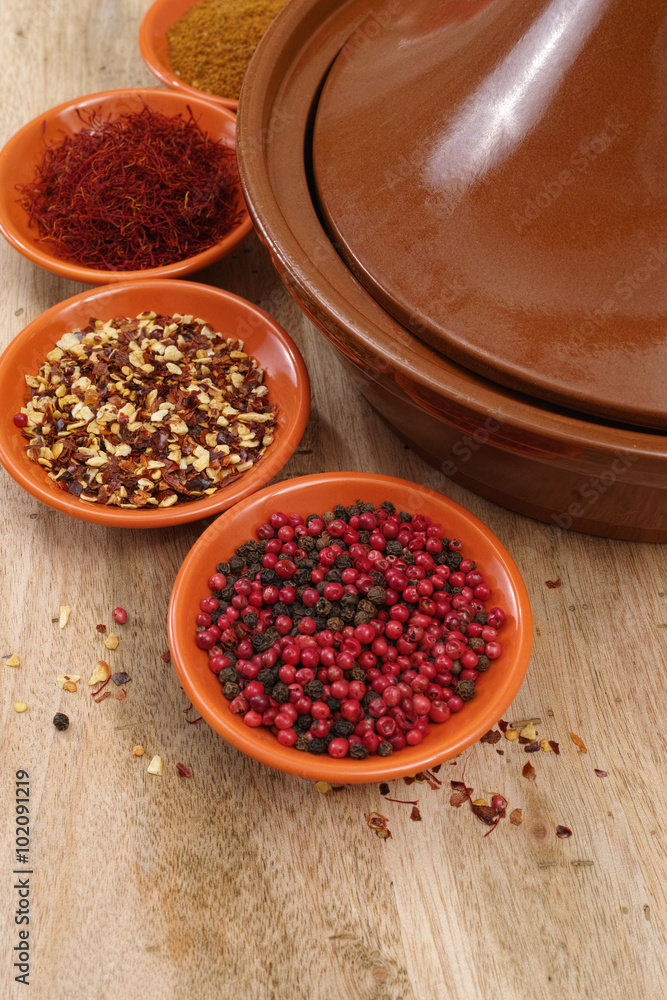Moroccan tahine with four bowls with spices Moroccan tahine with four bowls with spices