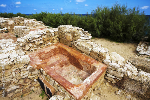 Tunisia. Ruins of Kerkouane - one of the most important Punic cities. One of many bathtubes photo