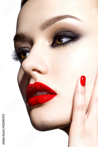 Beautiful young model with red lips.