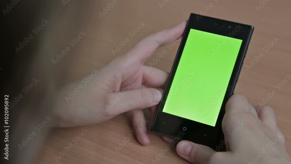 Woman watch oh her cell phone, green screen Woman watch oh her cell phone, green screen