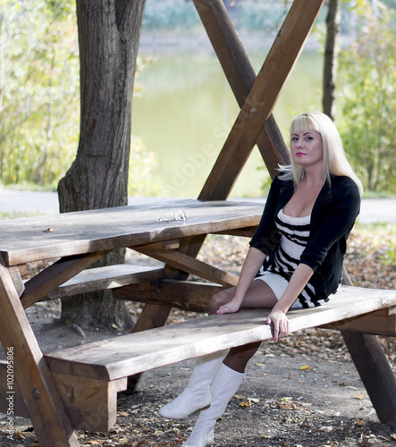 the beautiful woman on vacation at the lake, fall