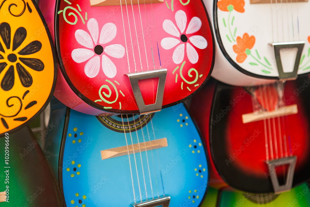 Obraz premium Colorful traditional mexican guitars on market. Great for background