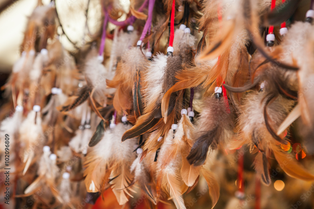 Close up of authentic dreamcatchers with feathers and beads