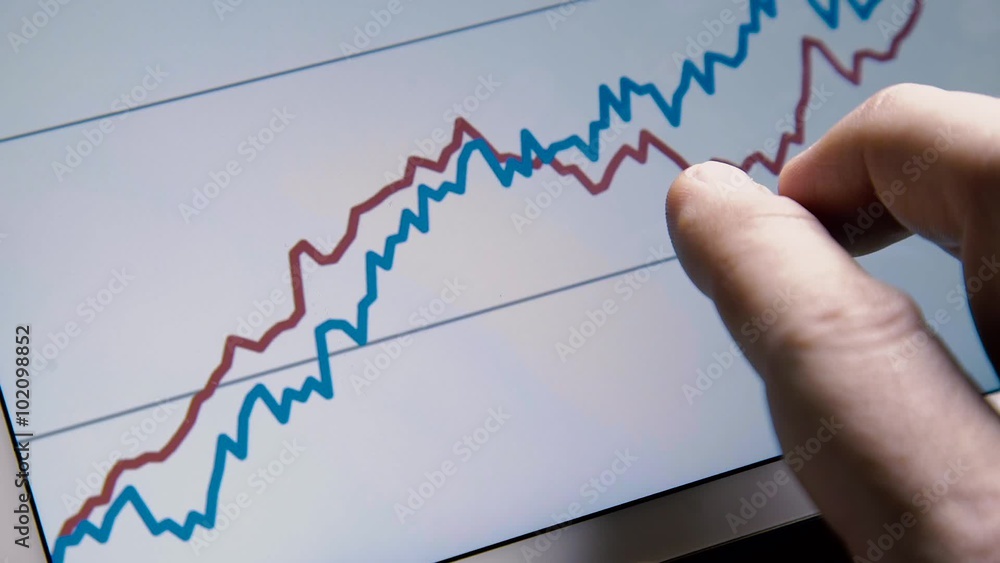 Business man hand with tablet browse rising diagram graph Business man hand with tablet browse rising diagram graph
