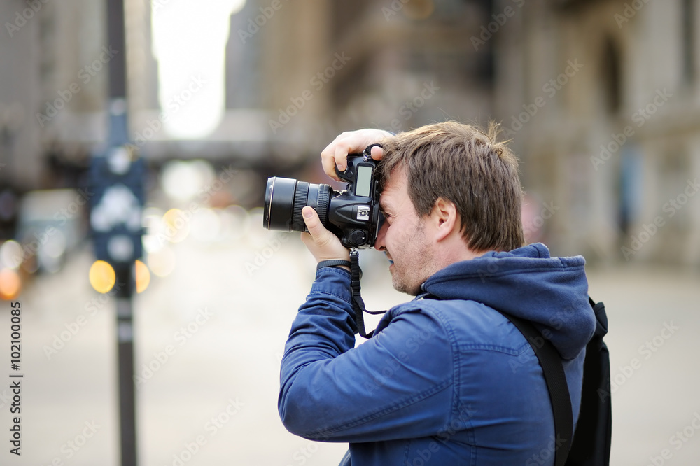 Photographer taking photo with professional digital camera Photographer taking photo with professional digital camera