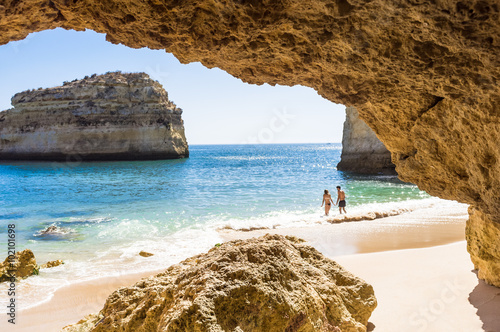 man and woman on a private beach, beautiful dream vacation by the sea