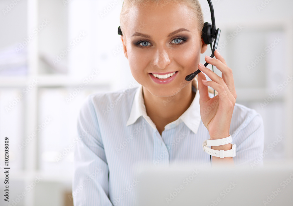 Close-up portrait of a customer service agent sitting at office Close-up portrait of a customer service agent sitting at office