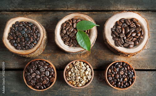 Collection of coffee beans on old wooden table, close up