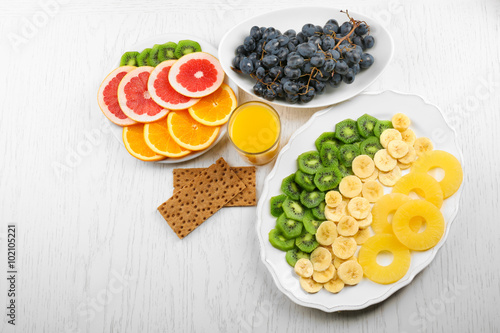 Fruits on light wooden background. healthy eating concept.
