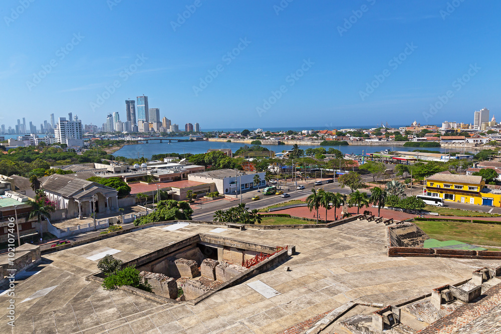 A view on historic and modern Cartagena from San Filipe de Barajas Castle, Colombia. City panorama and waters of Caribbean Sea on a beautiful morning.