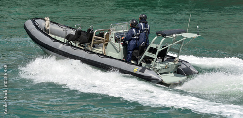 Royal New Zealand navy sailors ride a Zodiak Rigid-hulled inflat