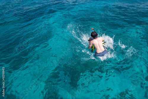 Man jumping to the sea