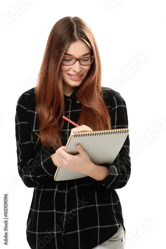 young woman holding sketchbook photo