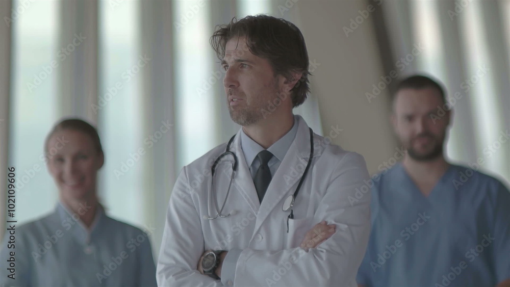 group of medical staff at hospital, doctor in front of team, people group standing together in background group of medical staff at hospital, doctor in front of team, people group standing together in background