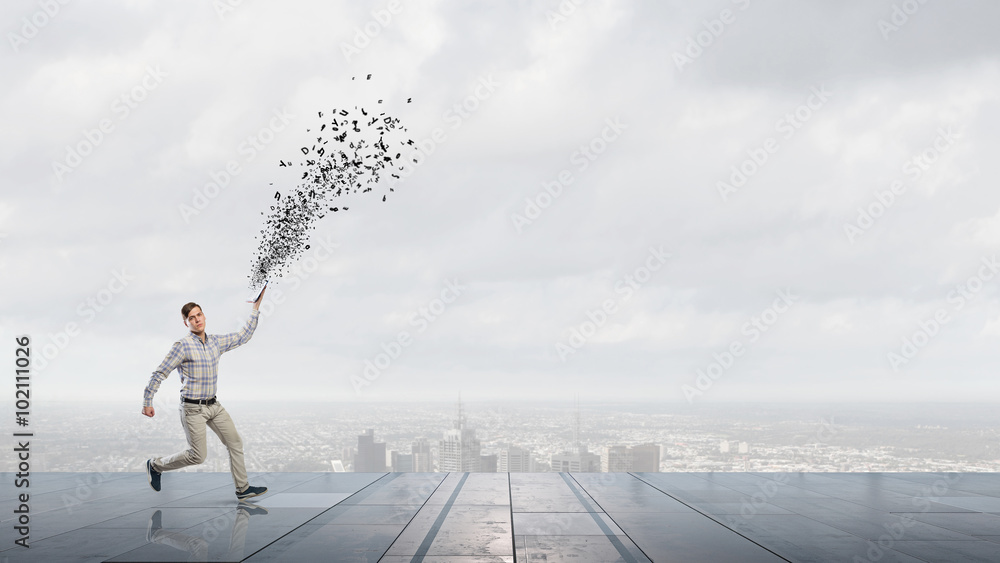 Man running with book