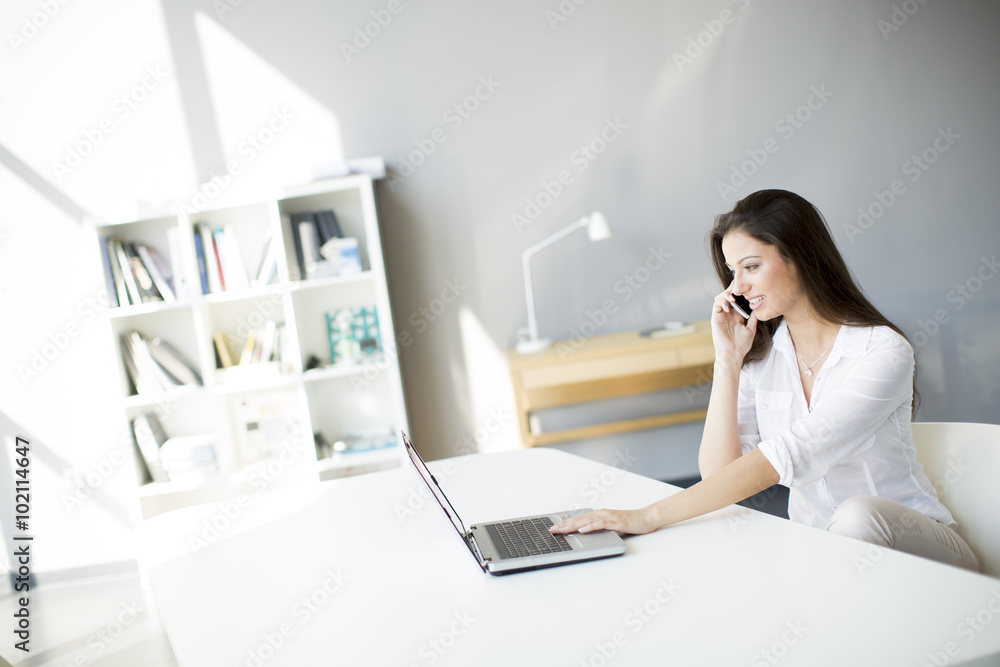 Young woman working in the office Young woman working in the office