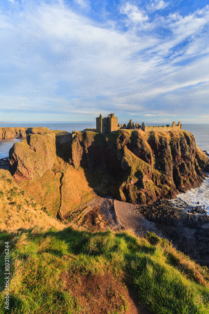 Fototapeta premium Dunnottar Castle with blue sky in - Stonehaven, Aberdeen, Scotland