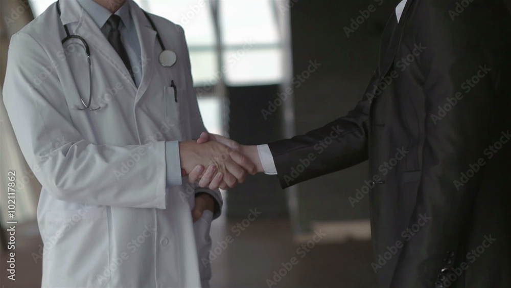 doctor with a patient family at bright modern office in hospital doctor with a patient family at bright modern office in hospital