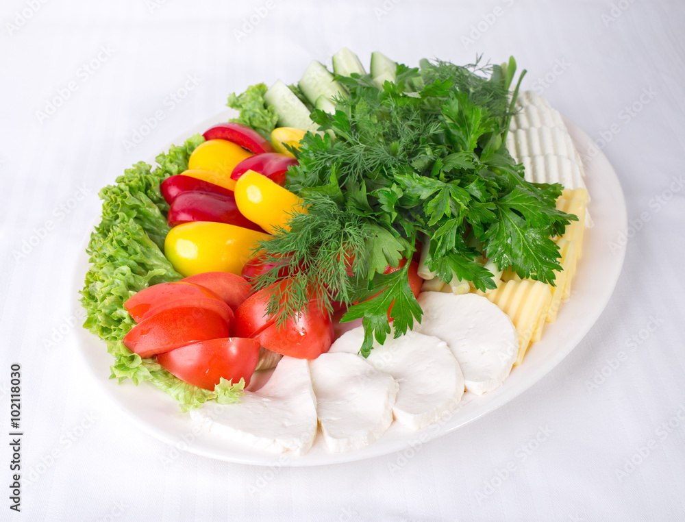 Fresh vegetables and various cheeses. Fresh vegetables and various cheeses.