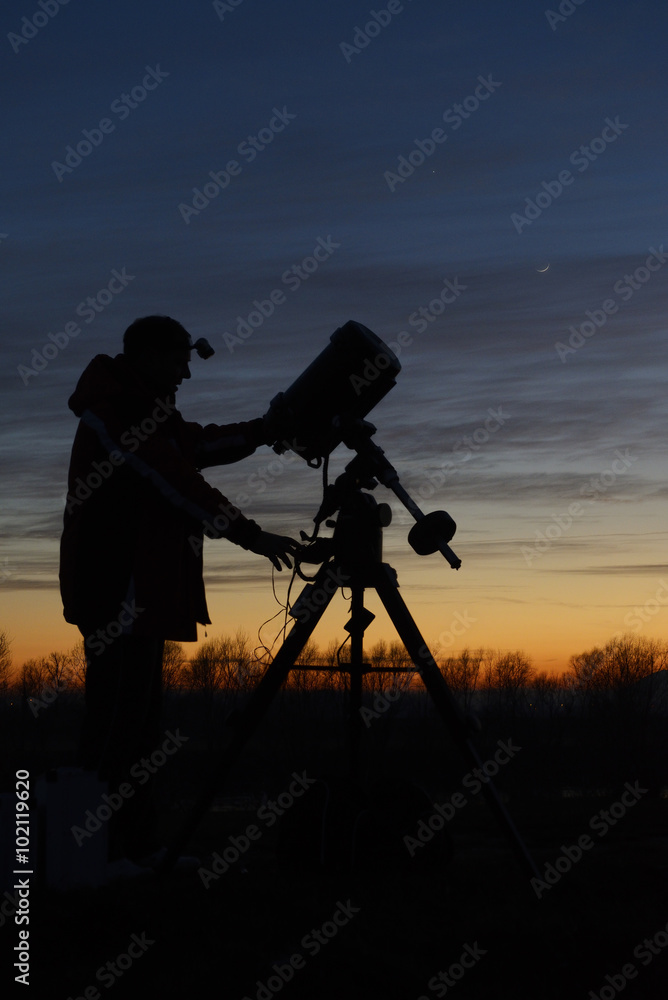 Amateur astronomer with his telescope