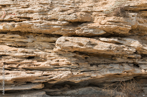 Texture of sandstone rocks exposed to erosion and destruction