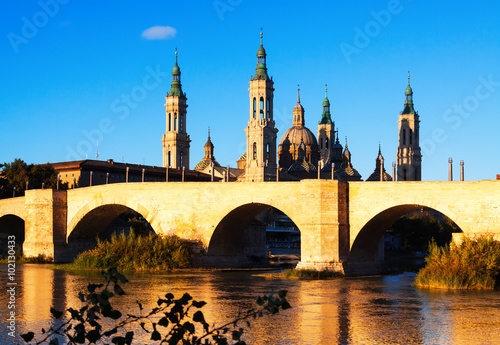 stone bridge and Cathedral in sunny morning. Zaragoza