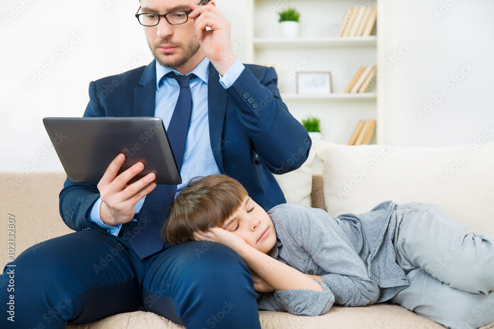 Busy father is working on tablet Busy father is working on tablet