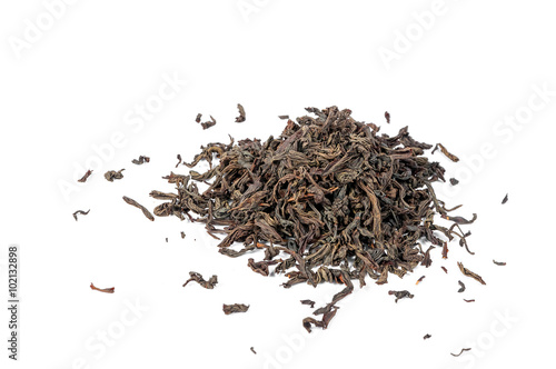 Dry black tea leaves isolated on white background