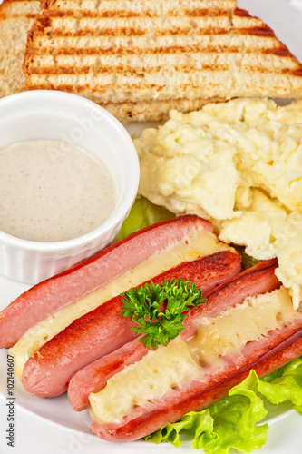 sausages with cheese and om...