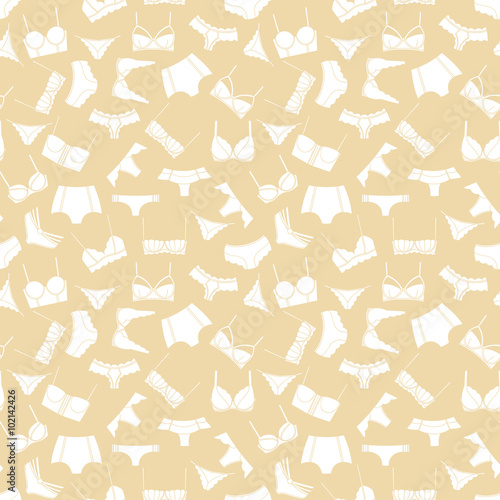 White lingerie on beige background seamless pattern