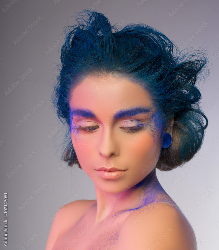 beautiful woman in pink and blue colors. studio shot. blue hair beautiful woman in pink and blue colors. studio shot. blue hair