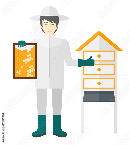 Bee-keeper at apiary.