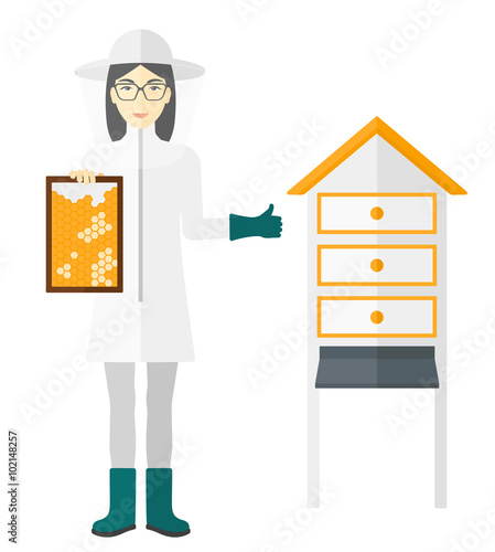 Bee-keeper at apiary.