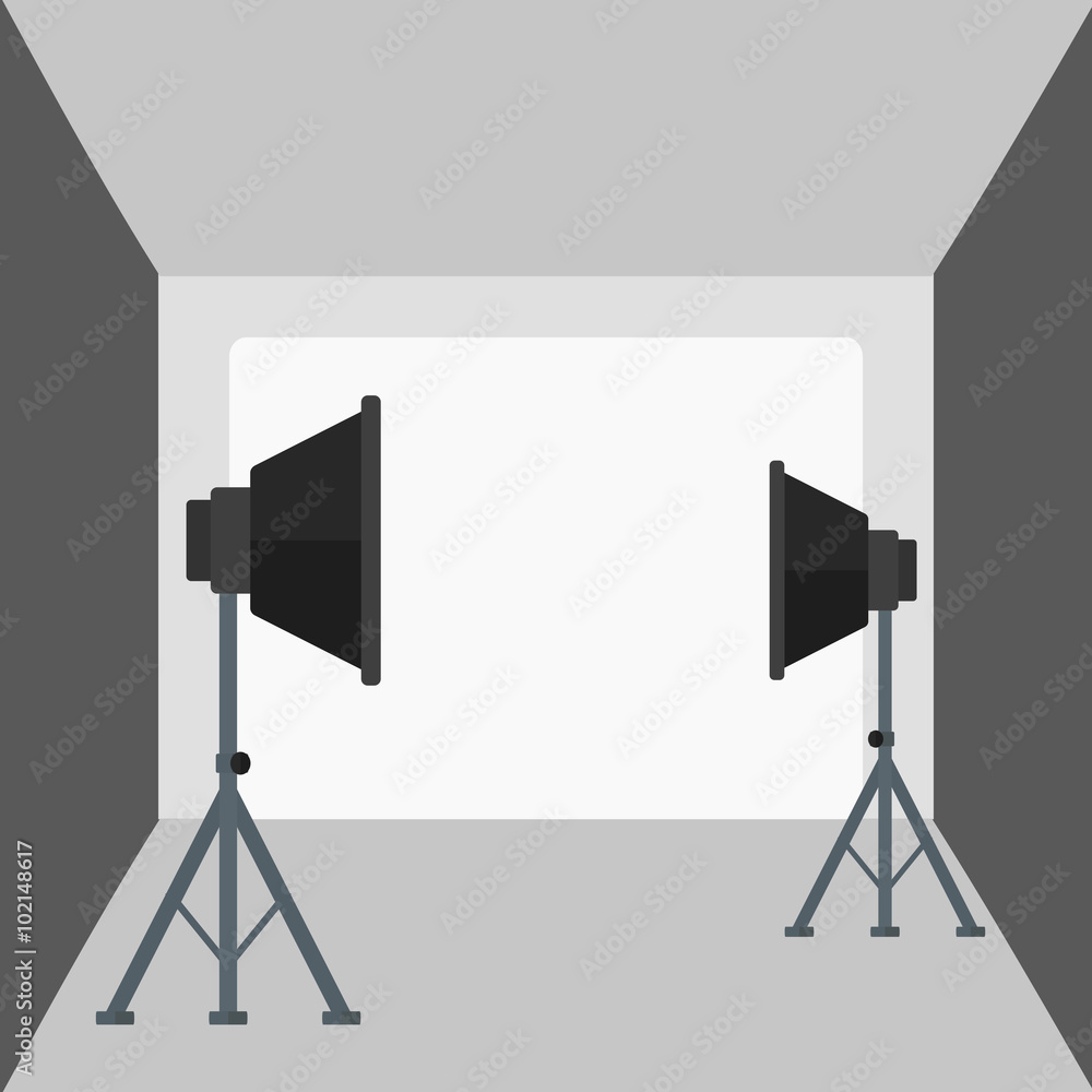 Background of empty photo studio with lighting equipment.