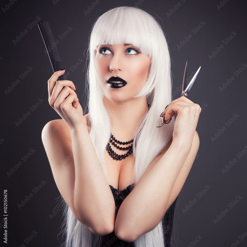 Obraz premium beautiful blonde woman with black make-up and accessories posing