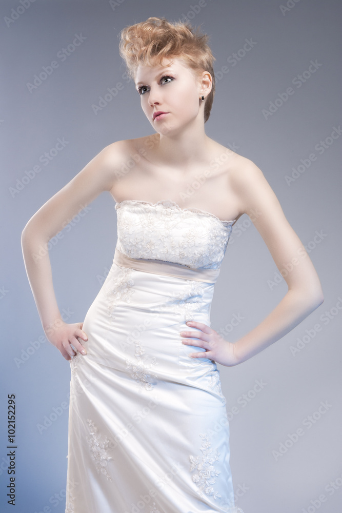Fashion Concepts. Tall Young and Sexy Blond Woman in Tailored Wedding Dress Fashion Concepts. Tall Young and Sexy Blond Woman in Tailored Wedding Dress