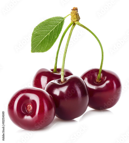 Juicy cherry with leaf close-up on a white background.