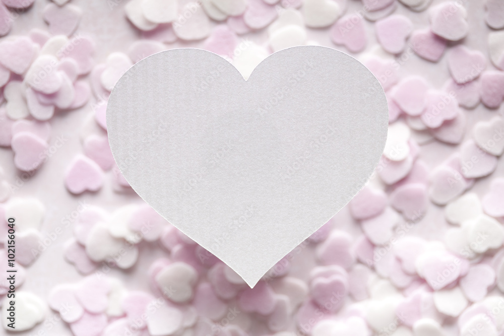 Obraz premium White paper heart and many small hearts in background